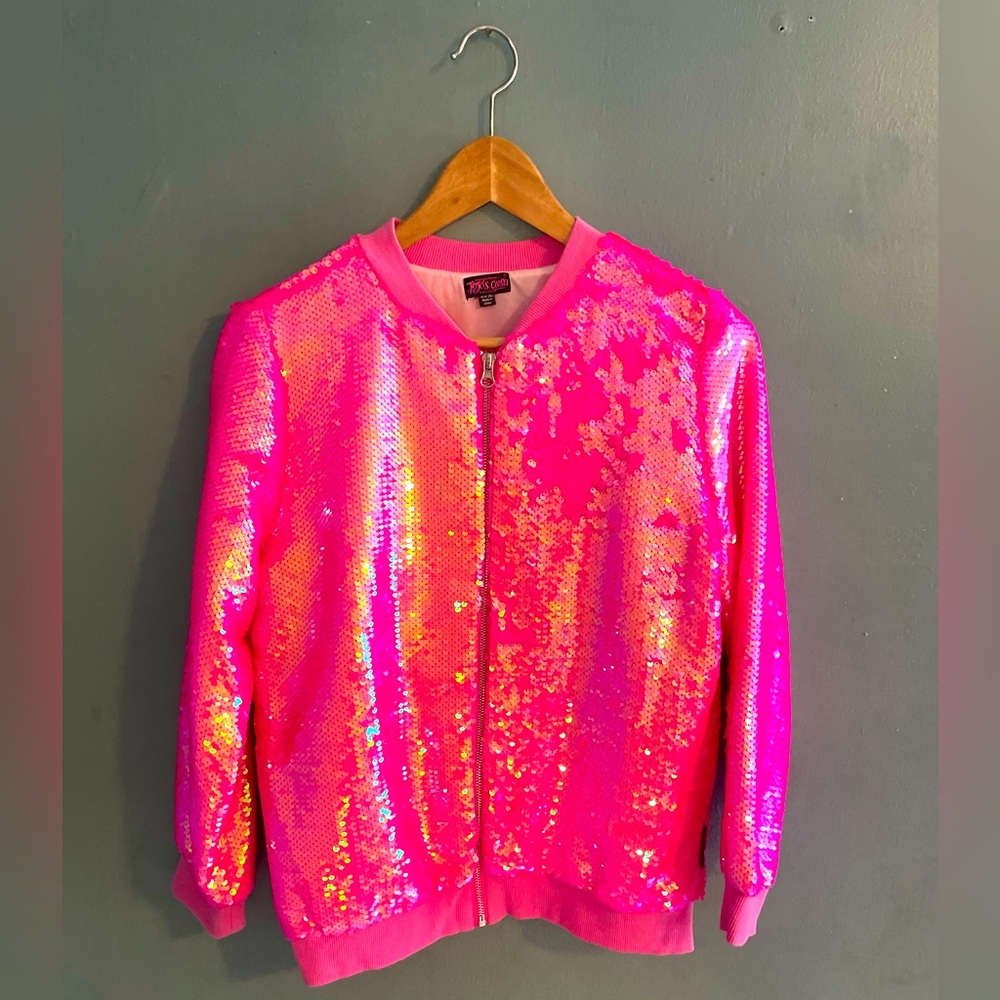 Be seen for miles as you shine down the street in this fun pink bomber jacket.